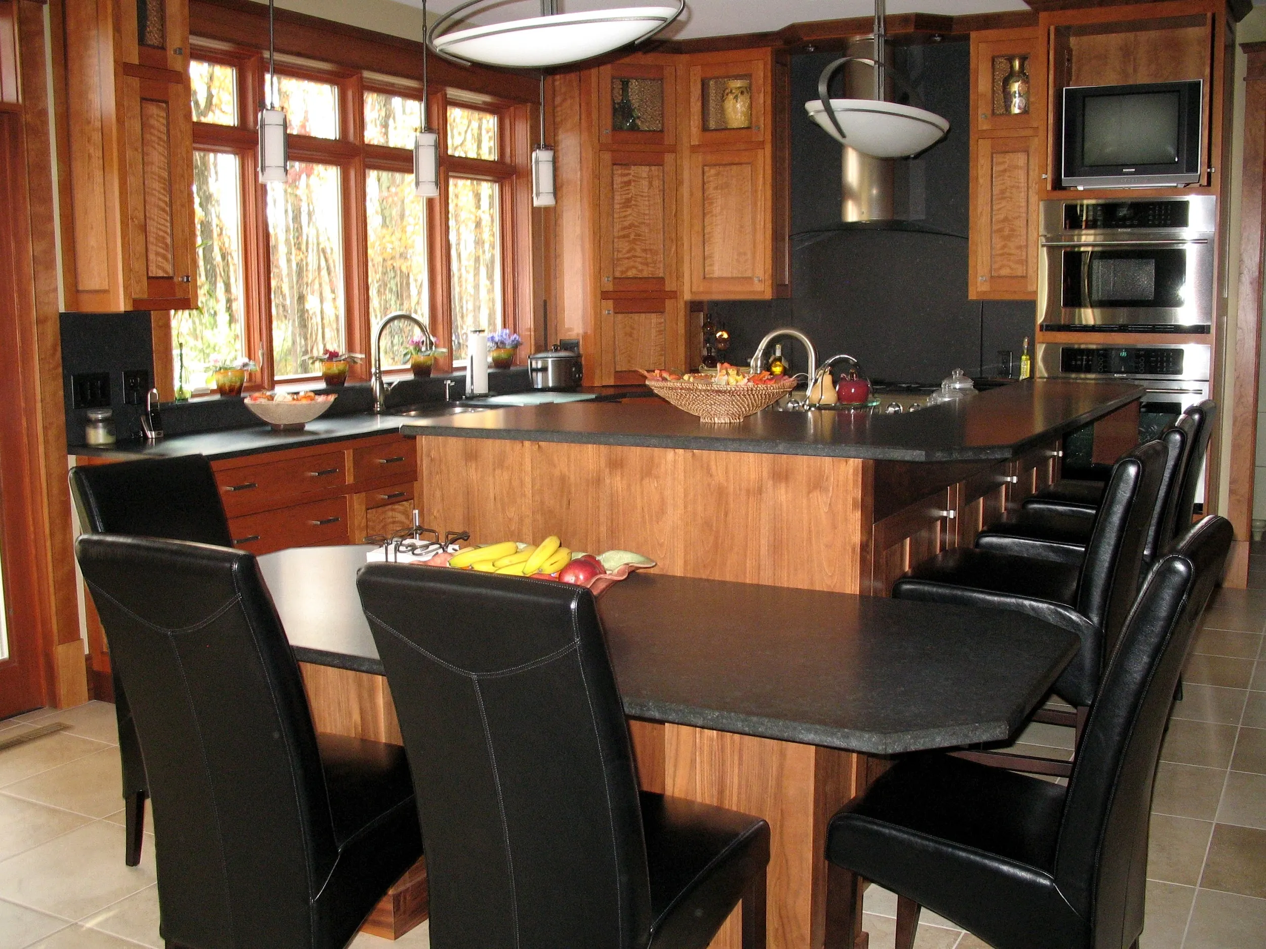 Custom granite kitchen island with wood cabinetry