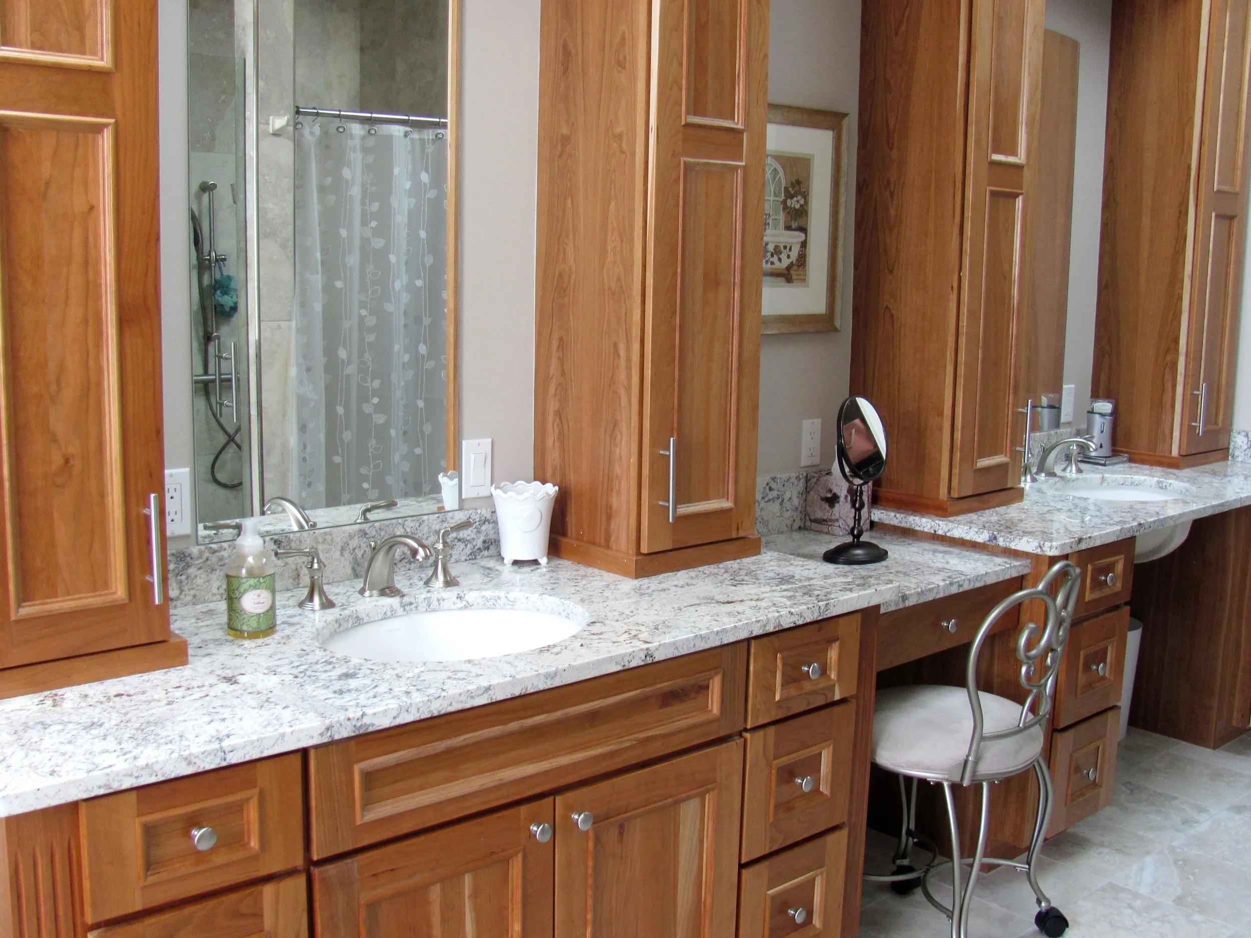 Marble bathroom vanity with custom cabinetry