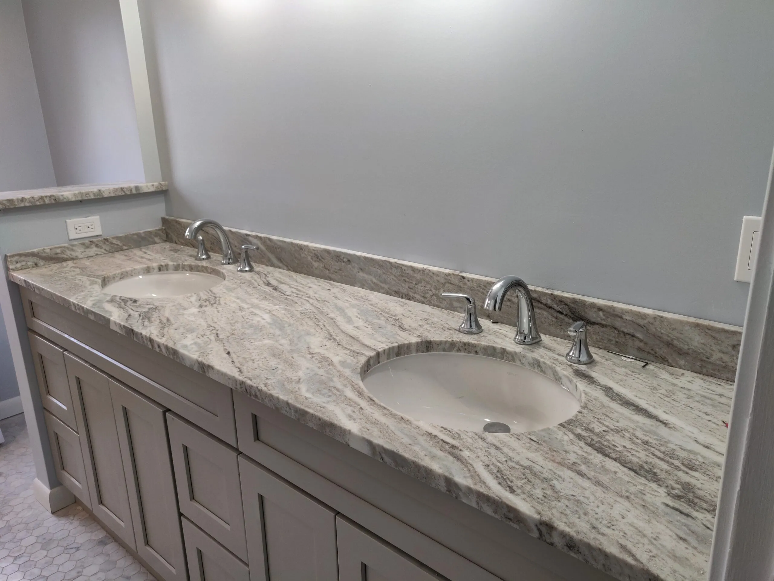 Custom bathroom vanity with granite countertop and two sinks
