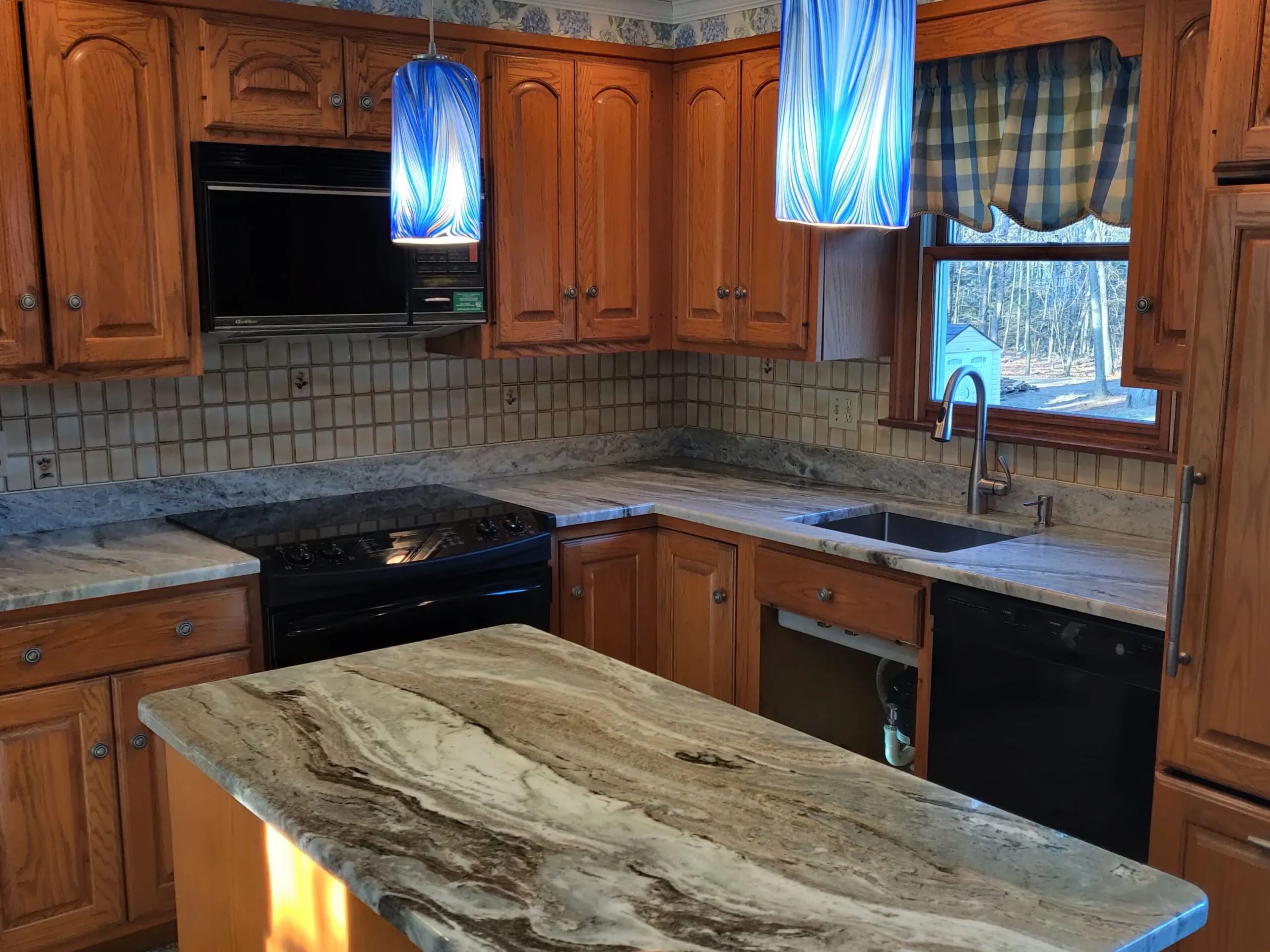 Modern white kitchen with stone countertops in Western Massachusetts