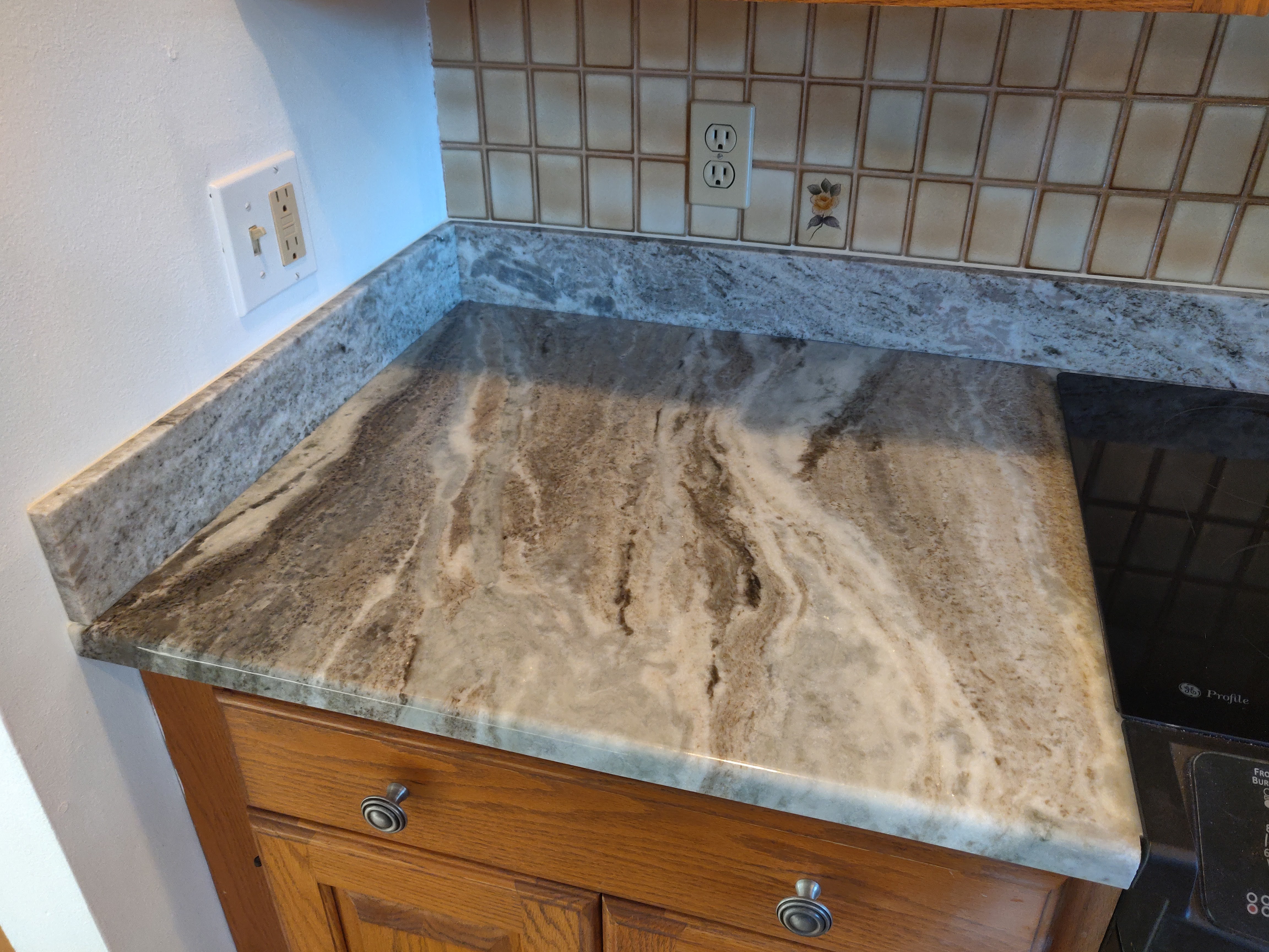 Full kitchen view showing granite transformation